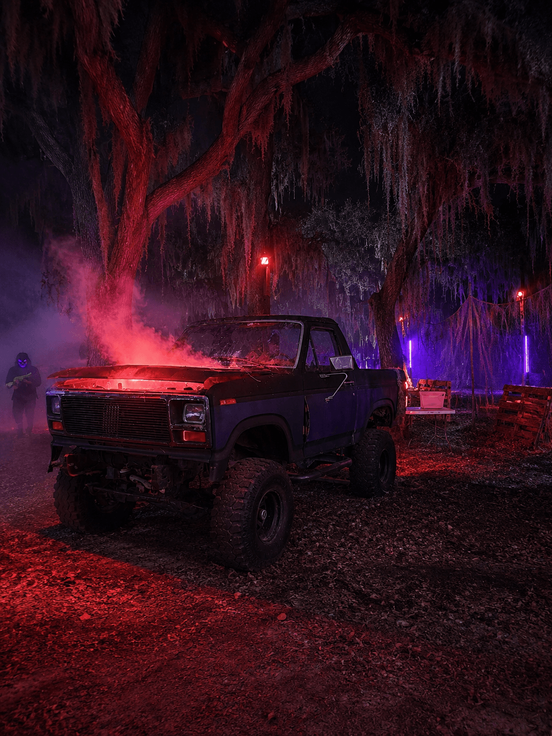A smoking broken-down truck lit red on the Terror 2 trail at Boggy Creek in 2026