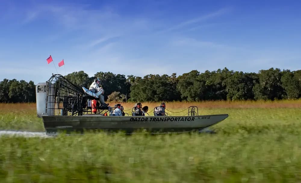 Airboat crossing open Florida marsh